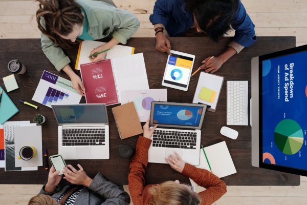 group of engaged people using different devices due to ecommerce personalization