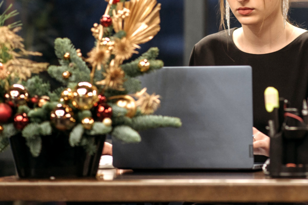 woman working on holiday email marketing campaign