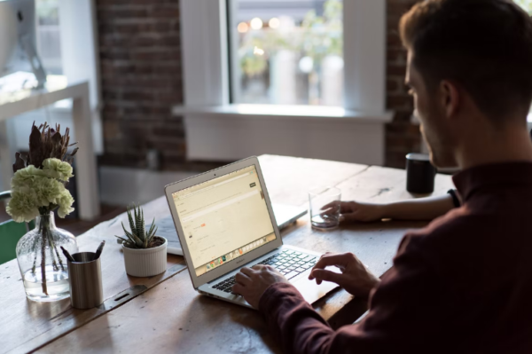 Man at a laptop in an office setting