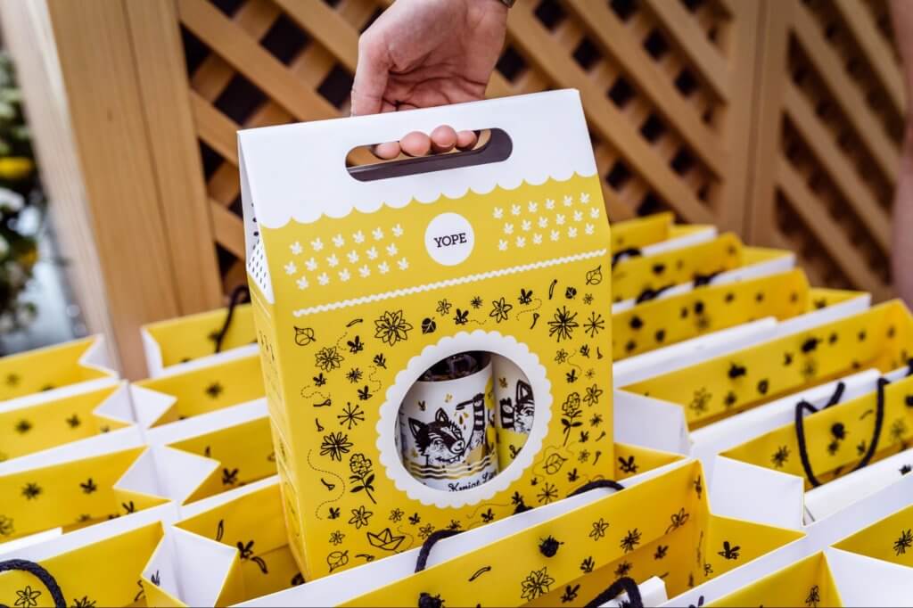 Yoke product packaging is a bright yellow, well designed box with handle