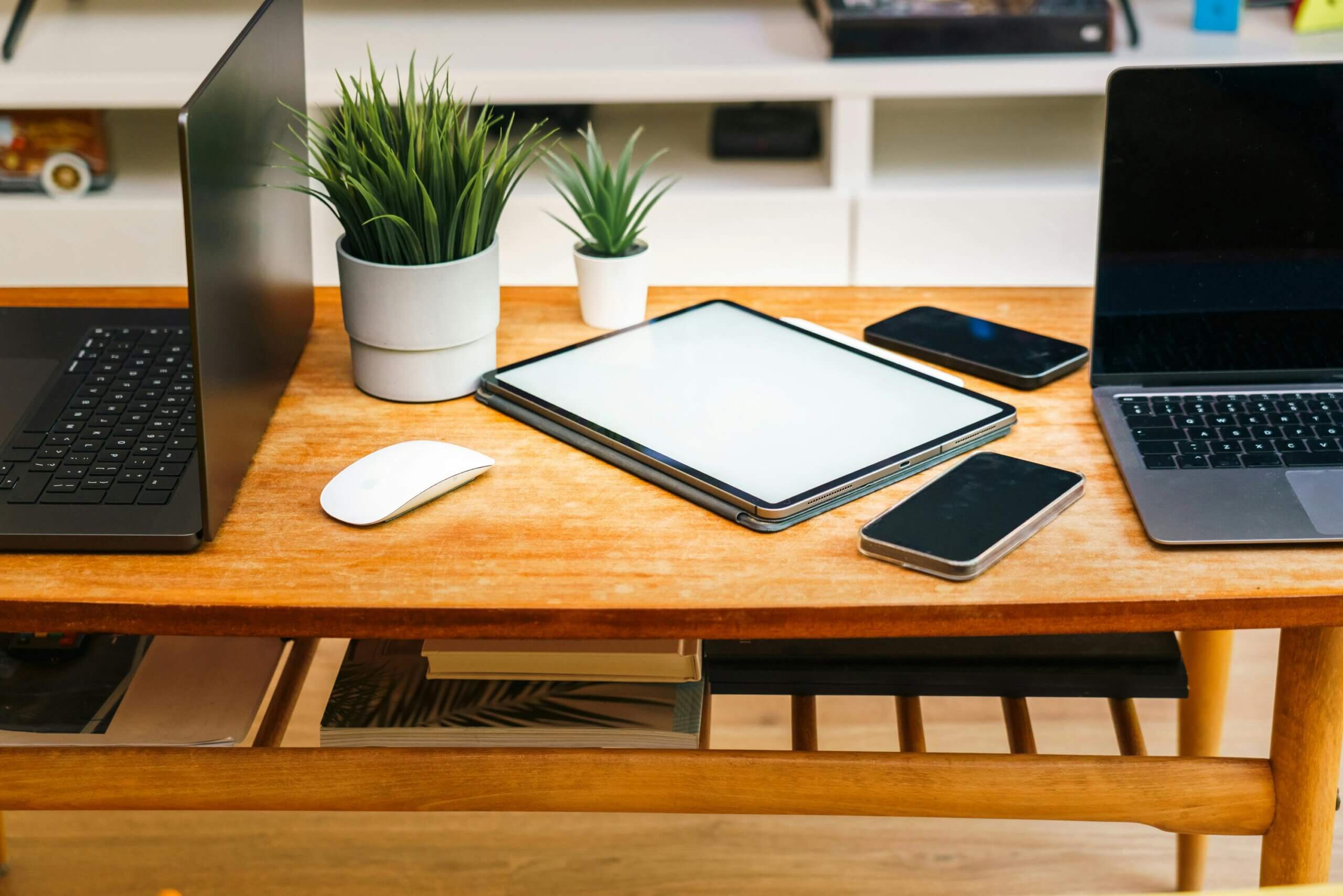 a variety of surfaces on a desktop as an example of feature parity isn't always the goal of a successful SaaS strategy.