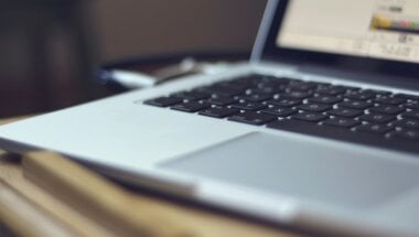 close up view of a laptop running a regulated SaaS application.