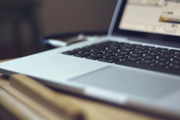 close up view of a laptop running a regulated SaaS application.