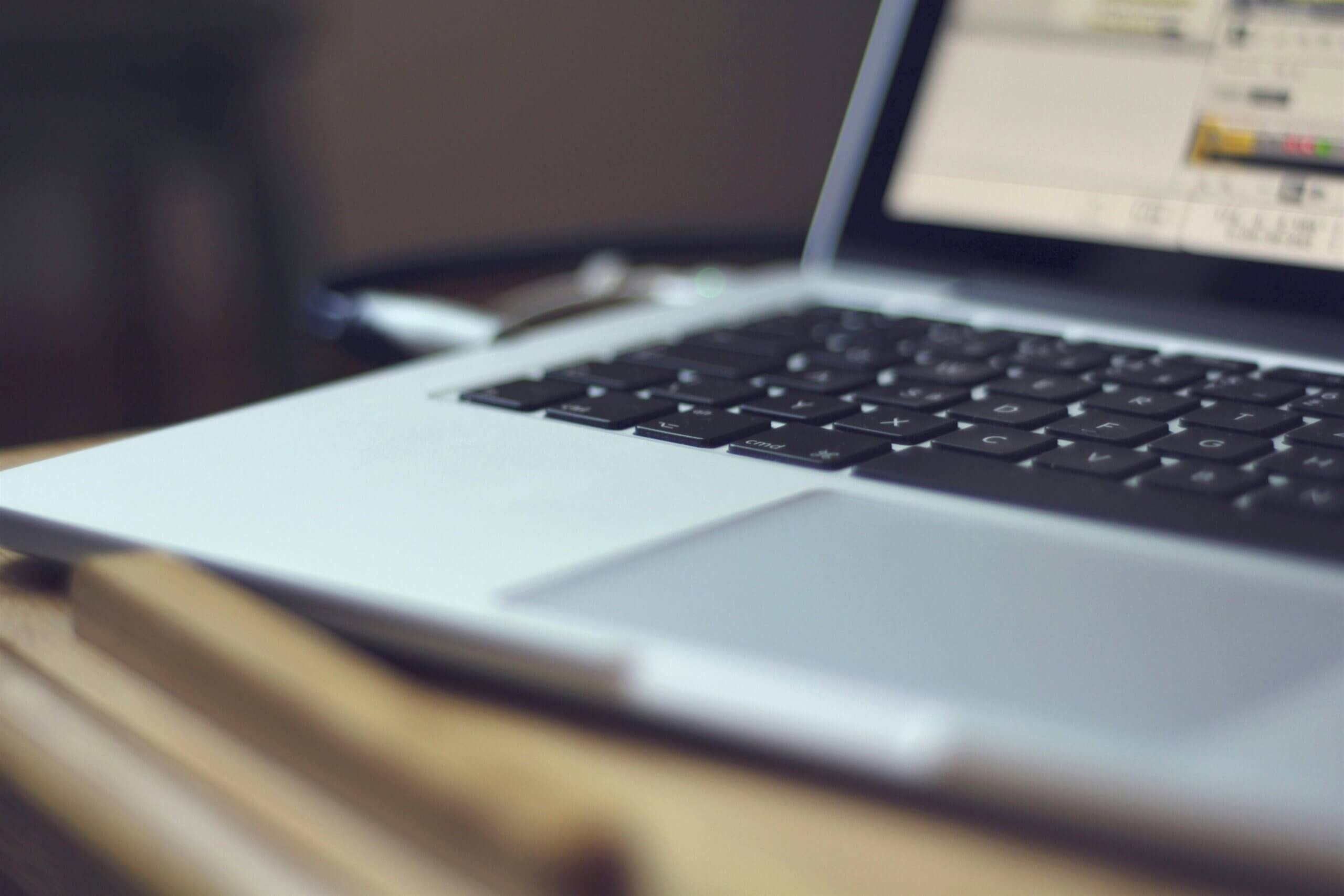 close up view of a laptop running a regulated SaaS application.