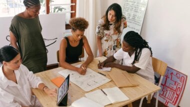 coworkers reviewing data on their high-value user segments.