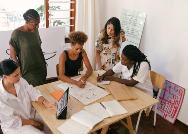 coworkers reviewing data on their high-value user segments.