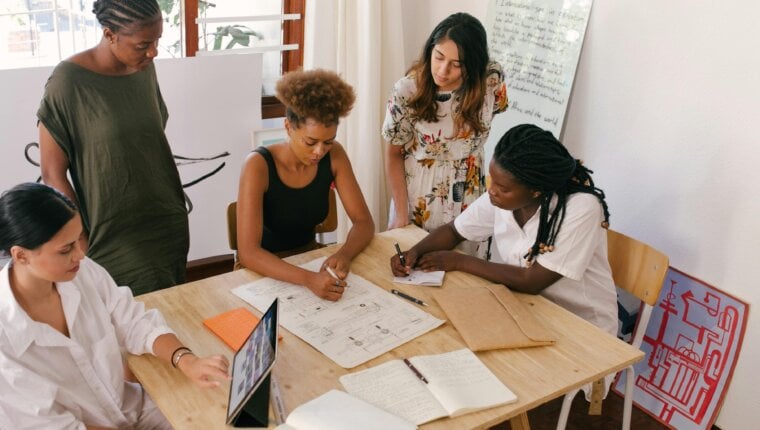 coworkers reviewing data on their high-value user segments.
