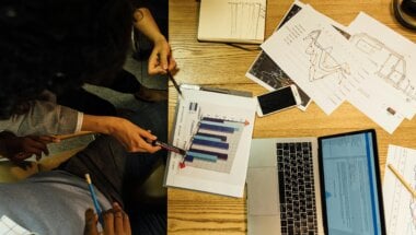 Colleagues reviewing data to make user-centered decisions