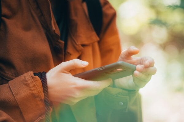 A person engaging with a SaaS trial on their mobile device.