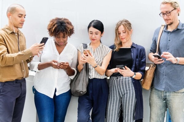 group of individuals using their cellphones